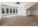 Bonus room featuring a large window and carpeted floors at 610 Hampshire Hill Rd, Matthews, NC 28105