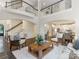 Open living space showcasing a view of the upstairs and an eat-in kitchen at 610 Hampshire Hill Rd, Matthews, NC 28105
