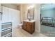 Bathroom with shower, tub, vanity and tile flooring, and view to a bedroom at 6417 Loyola Ct, Mint Hill, NC 28227