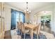 Elegant dining room with hardwood floors, chandelier, and views to the office and foyer at 6417 Loyola Ct, Mint Hill, NC 28227