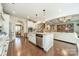 Modern kitchen featuring an island with granite countertops and stainless steel appliances at 6417 Loyola Ct, Mint Hill, NC 28227