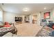 Basement living area features couches, a TV, built-in shelving, and neutral walls and carpet at 6417 Loyola Ct, Mint Hill, NC 28227