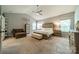 Spacious main bedroom with vaulted ceiling, upholstered headboard, and a sitting area at 6417 Loyola Ct, Mint Hill, NC 28227