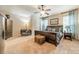 Serene main bedroom with a ceiling fan, a window view, and neutral tones at 6417 Loyola Ct, Mint Hill, NC 28227