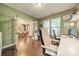 Bright office with hardwood floors, ample shelving, and french doors to the dining room at 6417 Loyola Ct, Mint Hill, NC 28227