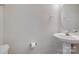 Powder room with a pedestal sink, decorative mirror, and ample space at 764 Atherton Way, Rock Hill, SC 29730