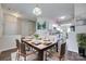 Bright dining area with modern table setting, steps away from a clean, all-white kitchen at 764 Atherton Way, Rock Hill, SC 29730