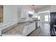 Modern kitchen with granite countertops, white cabinets, and stainless steel appliances at 764 Atherton Way, Rock Hill, SC 29730