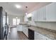 Well-lit kitchen featuring stainless steel appliances and granite countertops at 764 Atherton Way, Rock Hill, SC 29730