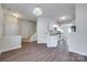 Open-concept living area with modern flooring connecting to the kitchen and staircase at 764 Atherton Way, Rock Hill, SC 29730