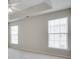 Bedroom featuring neutral walls, carpet flooring, ceiling fan, and two windows at 764 Atherton Way, Rock Hill, SC 29730