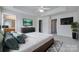 Large main bedroom with ceiling fan, tray ceiling, and ensuite bath at 764 Atherton Way, Rock Hill, SC 29730