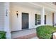 Inviting front porch with classic details, exterior lighting, and a well-kept landscape at 764 Atherton Way, Rock Hill, SC 29730