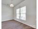 Bright room with hardwood floors and large windows, offering ample natural light at 764 Atherton Way, Rock Hill, SC 29730