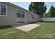 Backyard featuring a concrete patio and well-maintained lawn at 8655 Meadowmont View Dr, Charlotte, NC 28269