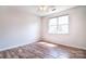 Bedroom featuring hardwood style flooring, ceiling fan, and natural light from the window at 8655 Meadowmont View Dr, Charlotte, NC 28269