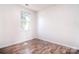Bedroom featuring hardwood style flooring and a bright window at 8655 Meadowmont View Dr, Charlotte, NC 28269