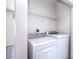 Convenient laundry room includes shelving and modern appliances at 8655 Meadowmont View Dr, Charlotte, NC 28269