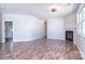 Bright living room with a fireplace, wood-look floors, and a neutral color scheme, perfect for relaxation and entertaining at 8655 Meadowmont View Dr, Charlotte, NC 28269