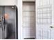 Pantry with coated wire shelving and door storage at 8655 Meadowmont View Dr, Charlotte, NC 28269