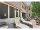 Outdoor seating area with lounge chairs and a beautiful brick exterior at 10007 Hillspring Dr, Huntersville, NC 28078
