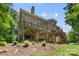 Spacious backyard with a large deck, perfect for entertaining or relaxing outdoors at 10007 Hillspring Dr, Huntersville, NC 28078