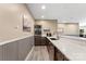 Kitchen wet bar with stainless steel microwave, oven, and quartz countertops at 10007 Hillspring Dr, Huntersville, NC 28078