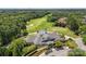 Aerial view of a clubhouse with a golf course in the background at 10007 Hillspring Dr, Huntersville, NC 28078