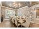 A dining room with a farmhouse table and large brick accent wall at 10007 Hillspring Dr, Huntersville, NC 28078