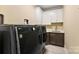 Laundry room featuring modern washer/dryer and ample storage at 10007 Hillspring Dr, Huntersville, NC 28078