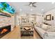 Spacious living room with a fireplace, hardwood floors, and comfortable seating at 10007 Hillspring Dr, Huntersville, NC 28078