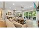 Bright and airy living room with a sliding door, modern furnishings, and hardwood floors at 10007 Hillspring Dr, Huntersville, NC 28078