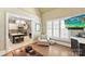 Bright living room with fireplace, comfortable seating and a view of the kitchen at 10007 Hillspring Dr, Huntersville, NC 28078