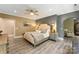 Comfortable primary bedroom with a plush bed and neutral decor at 10007 Hillspring Dr, Huntersville, NC 28078