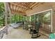 Covered outdoor patio with rocking chairs and a hammock at 10007 Hillspring Dr, Huntersville, NC 28078