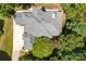 Aerial view of a well-maintained roof with trees and manicured lawn at 10007 Hillspring Dr, Huntersville, NC 28078
