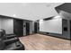 Home theater with a projection screen and reclining leather seats at 10007 Hillspring Dr, Huntersville, NC 28078