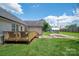 Spacious backyard with a deck and ample green space for recreation and relaxation at 104 Nottingham Dr, Maiden, NC 28650