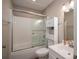 Bathroom featuring tiled shower, storage cabinets, toilet, and vanity sink at 104 Nottingham Dr, Maiden, NC 28650