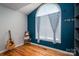 Sun-filled room featuring arched windows, and a built-in bookcase at 104 Nottingham Dr, Maiden, NC 28650