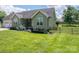 Beautiful home with a well-maintained lawn and a classic wooden fence adding charm to the property at 104 Nottingham Dr, Maiden, NC 28650
