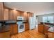 Kitchen featuring stainless steel appliances, wood cabinets, and a view of the dining area at 104 Nottingham Dr, Maiden, NC 28650