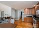 Kitchen with wood cabinets, stainless steel appliances, and a pass-through to the living spaces at 104 Nottingham Dr, Maiden, NC 28650