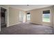 Spacious bedroom with carpet, two windows, and an en-suite bathroom at 104 Nottingham Dr, Maiden, NC 28650