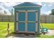 Stylish blue shed with contrasting trim on a well-manicured lawn at 104 Nottingham Dr, Maiden, NC 28650