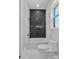 Modern bathroom featuring a tub with black and white tiled wall and sleek fixtures at 106 Kelly Marie Ct, Kings Mountain, NC 28086