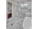 Bright bathroom features marble floors and walls, walk-in closet, soaking tub and glass shower at 106 Kelly Marie Ct, Kings Mountain, NC 28086