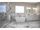 Bathroom with marble tiled shower, modern tub, double vanity, and gold fixtures at 106 Kelly Marie Ct, Kings Mountain, NC 28086