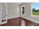 A bright, modern bedroom with hardwood floors and large windows offering natural light at 106 Kelly Marie Ct, Kings Mountain, NC 28086