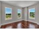 Bright bedroom features hardwood floors, three large windows offering lots of natural light, and neutral walls at 106 Kelly Marie Ct, Kings Mountain, NC 28086
